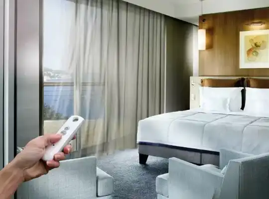 remote-controlled curtain system in a modern bedroom with a lake view